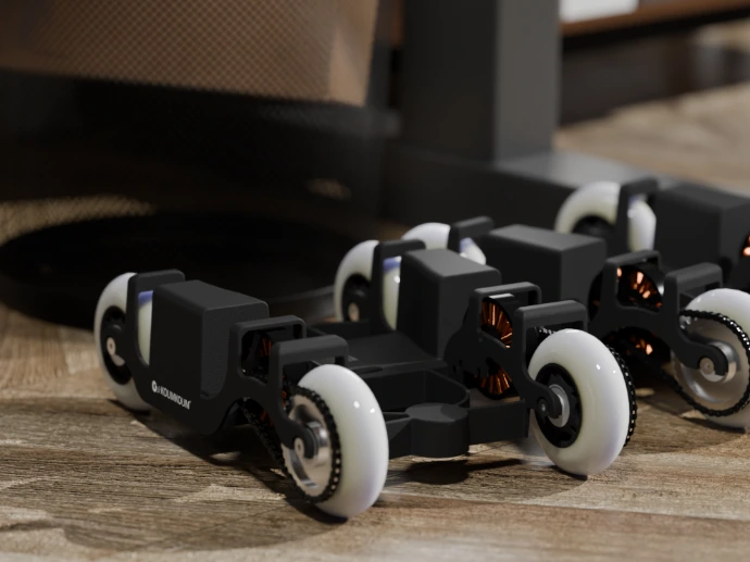 A pair of KoumKoums under an office desk, discreet, taking about the same area as a paper bin.